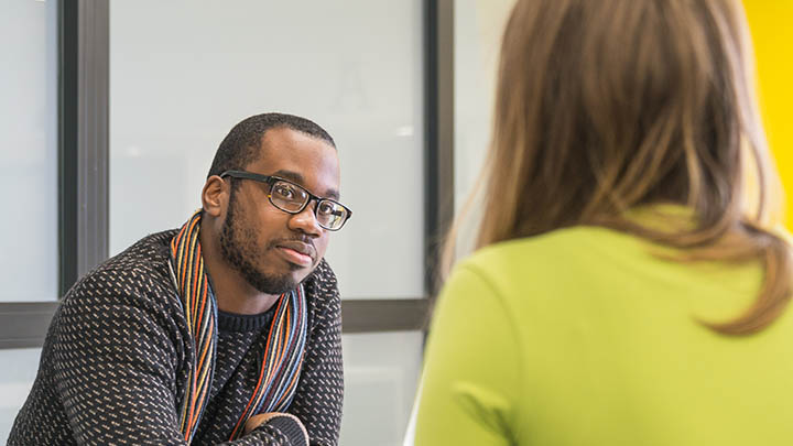 Two students in discussion.