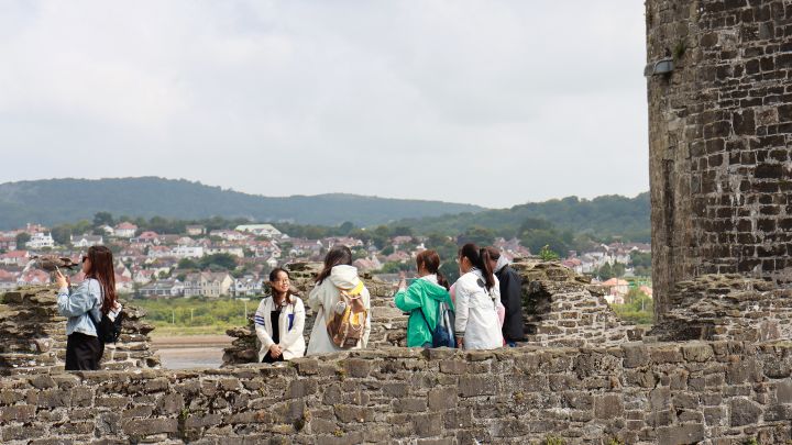 Students taking pictures at a castle