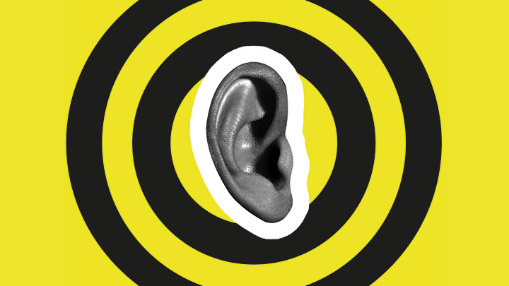 A human ear inside concentric circles, representing a target.