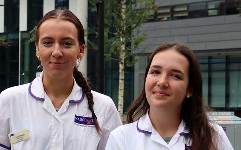 Student nurses outside Jean Mcfarlane Building University